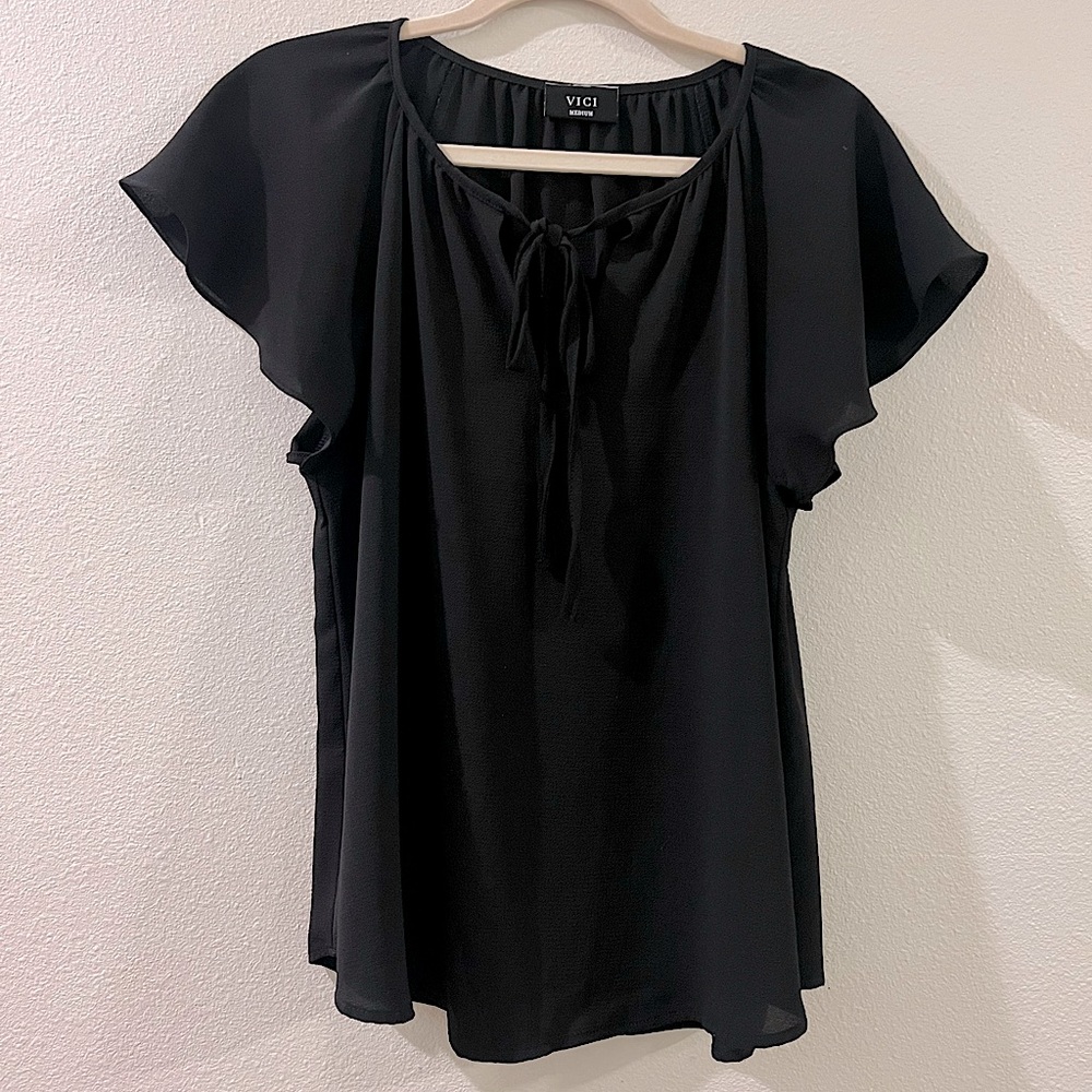 Black blouse with flowy sleeves